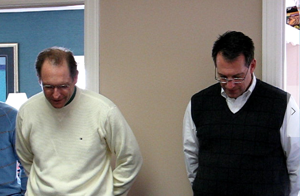 Byron and Wayne Saying Grace at the 2008 Christmas Party